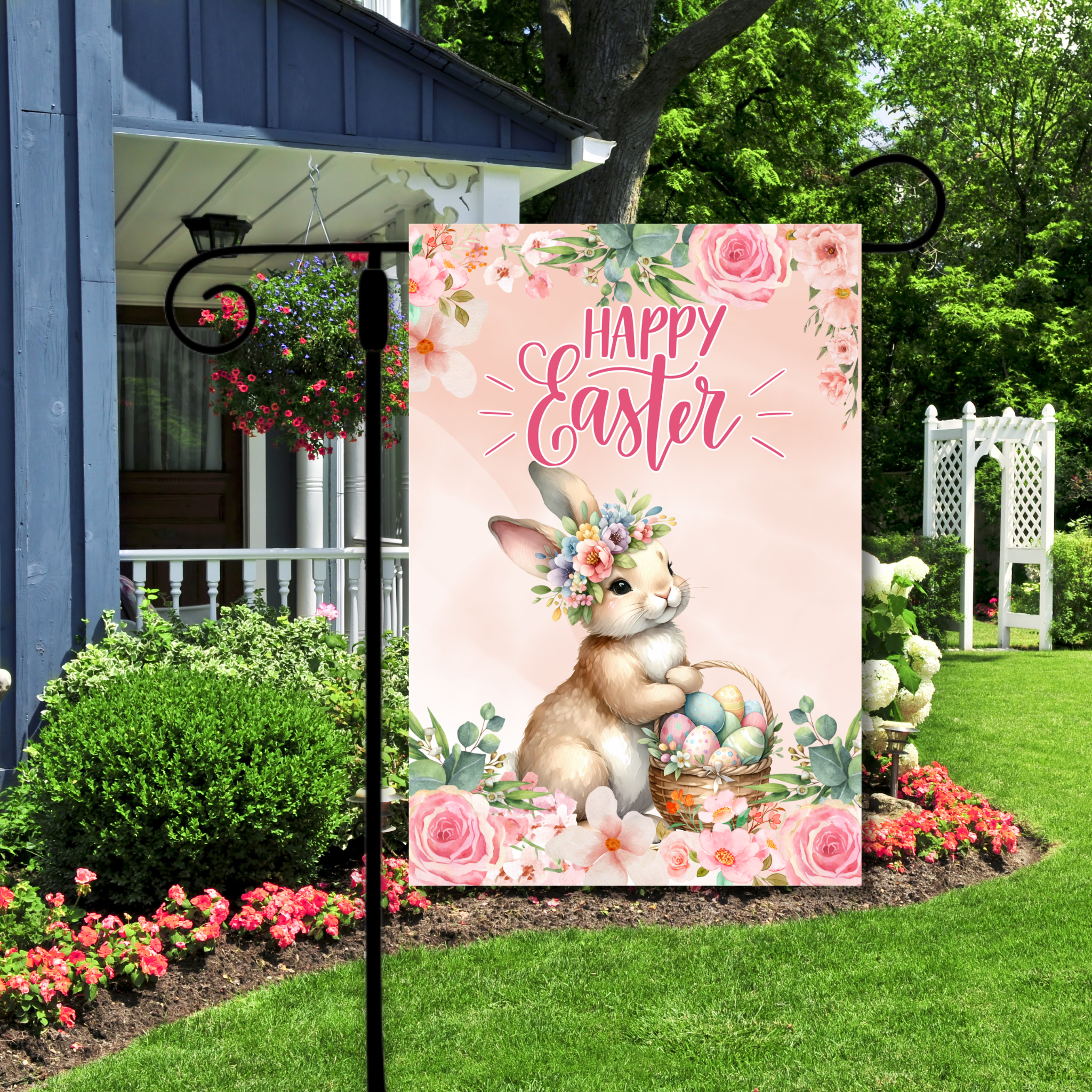 Decorative Easter sign with a bunny and flowers in front of a house.