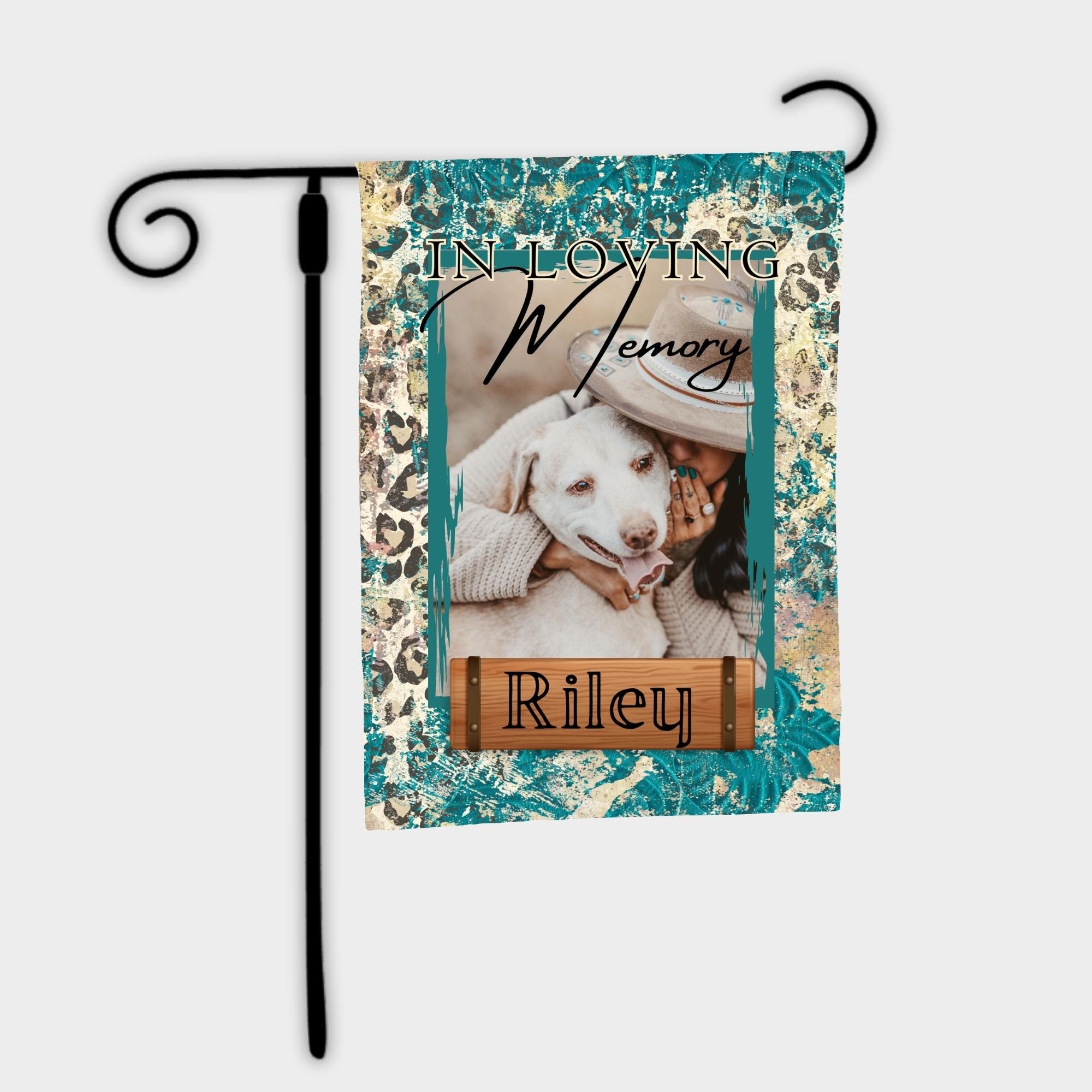 Memorial garden flag with a photo of a person holding a dog and text 'In Loving Memory Riley on a decorative background.