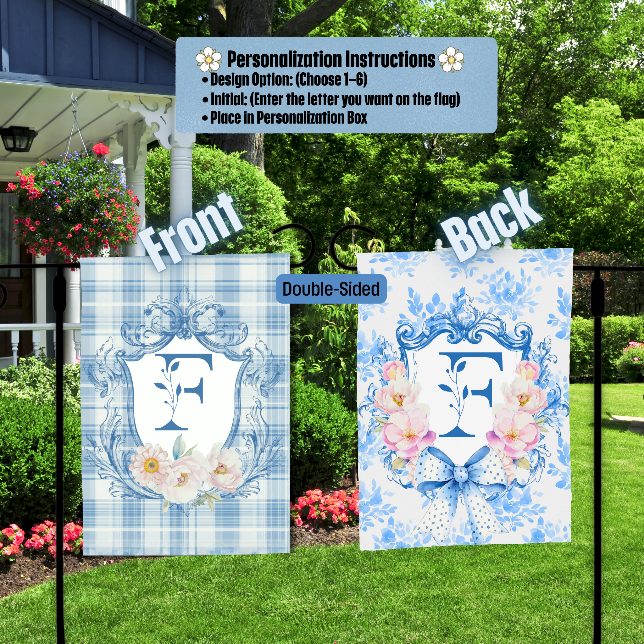 Double-sided garden flag with floral design and letter 'E' in a decorative frame, placed outdoors.