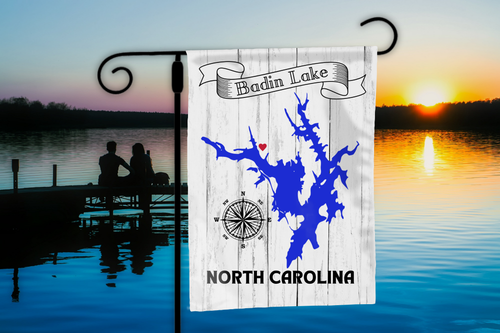 Flag with Badin Lake, North Carolina design against a lake sunset background