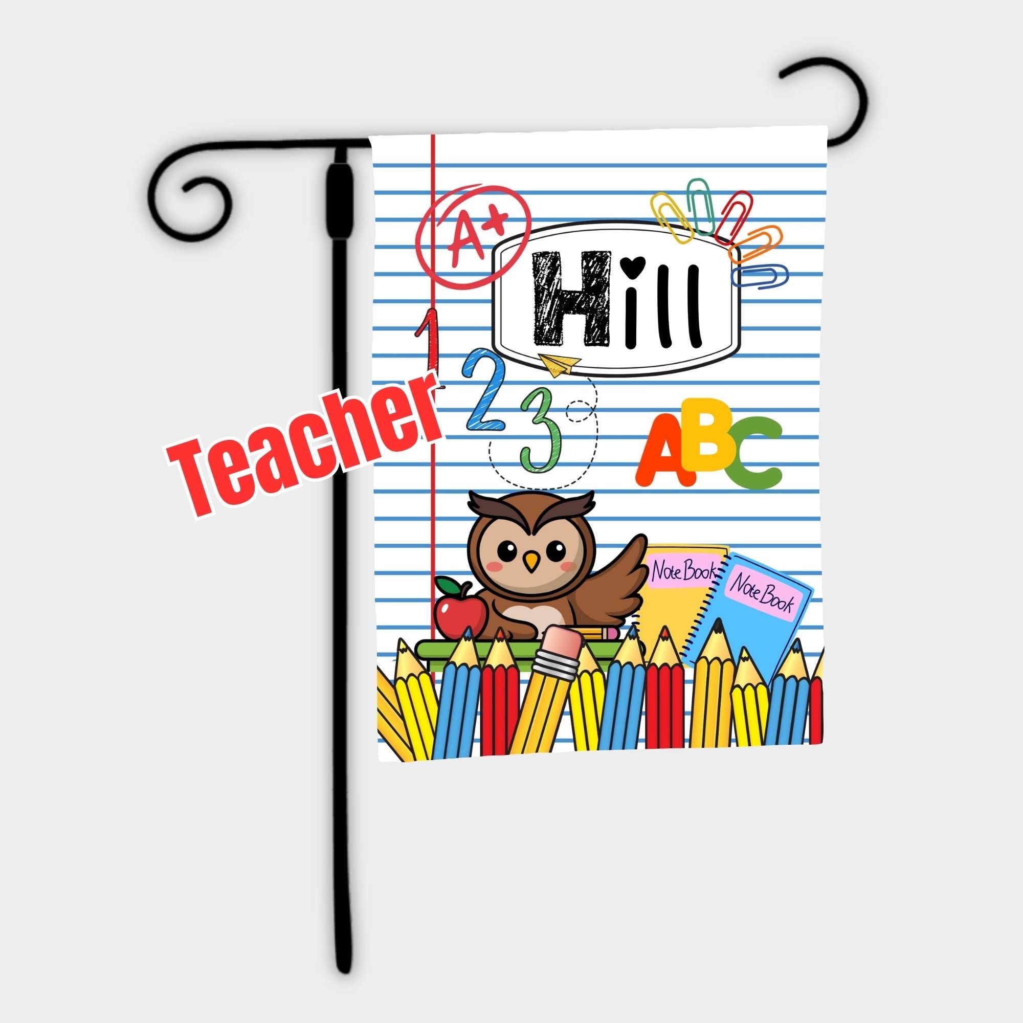Decorative garden flag with educational design featuring an owl, pencils, and books on a white background.