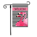 Flag with pink flamingos and black and white stripes, featuring the name 'Wilson'.